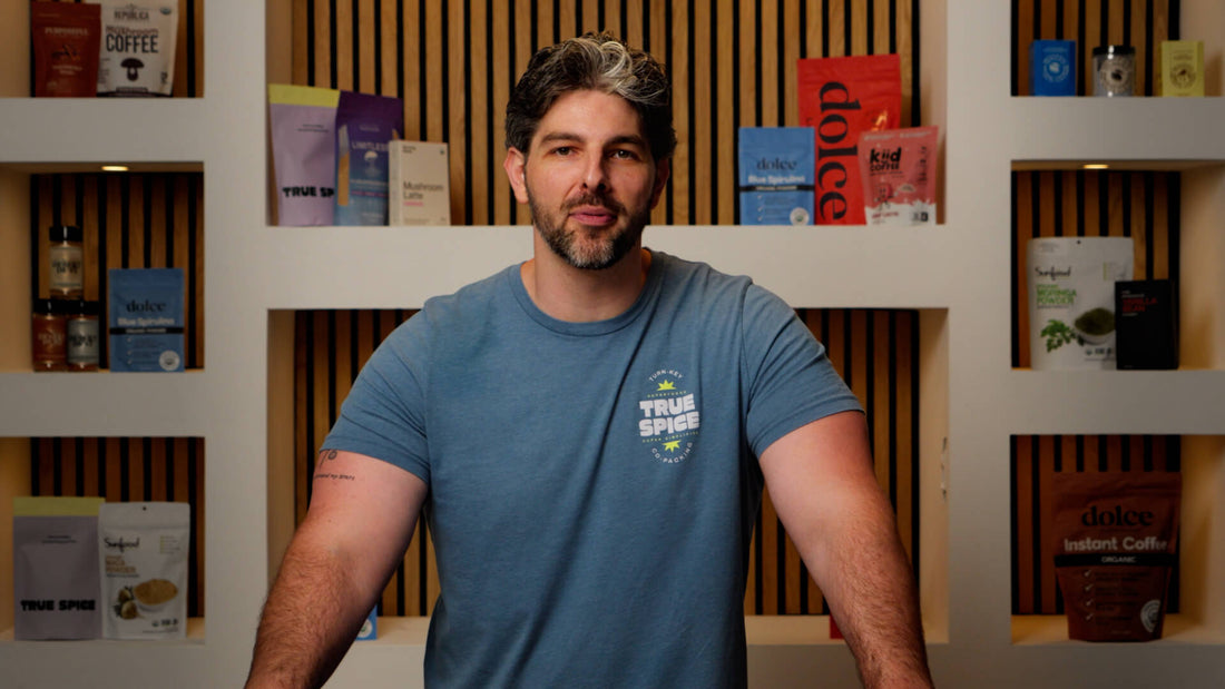 True Spice founder and team at certified supplement manufacturing facility offering turnkey organic and functional food production.