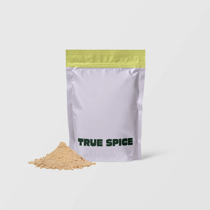 True Spice Chaga mushroom powder in branded pouch with loose powder in front